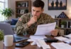 Can CashNetUSA Lend to Active-Duty Service members? Service member reviewing loan papers at a desk